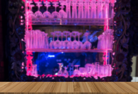 wine glass on bar counter with wood table for display or montage productの写真素材