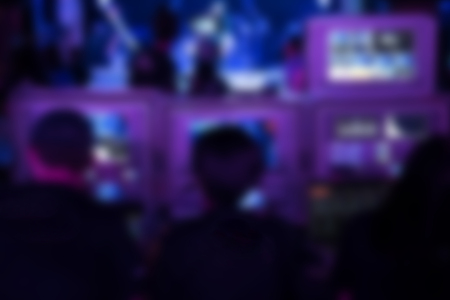 tv editor working with vision mixer panel at live concert. television engineer crew working with video and audio mixer for broadcasting event on stage in night club. blur backgroundの写真素材