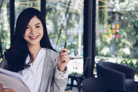 confident businesswoman shows analytic accounting market chart and graph. successful woman present financial report summary. business statistics performance conceptの写真素材