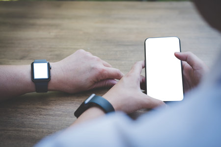 young man holding smartphone outdoor. social network communication, wireless connection, lifestyle...