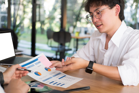 young business people having a meeting in office. businessman & businesswoman working together at workplace. startup man & woman have a discussion. Conference, teamwork, collaboration, corporate concept.の写真素材