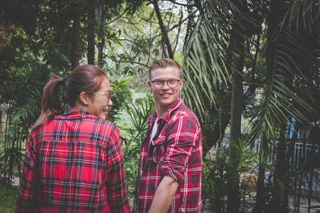 young couple in love holding hands. boyfriend & girlfriend dating in valentine's day. man & woman walking outdoor. relationship, lover lifestyle conceptの写真素材