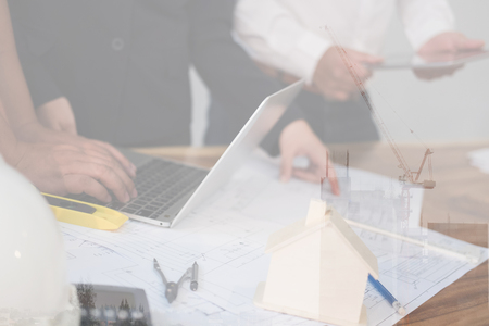 architect working on real estate project with partner at workplace.の写真素材