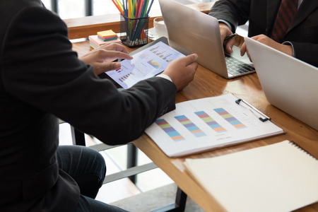 business inspector analyze financial plan report. businessman working with new startup project. internal auditor audit performance revenue at office.の写真素材