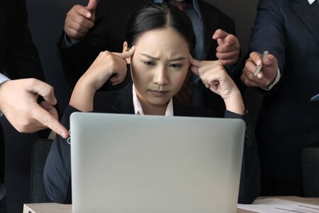 desperate businesswoman overwhelmed with hard work. overworked woman suffering stress. exhausted secretary burnoutの写真素材