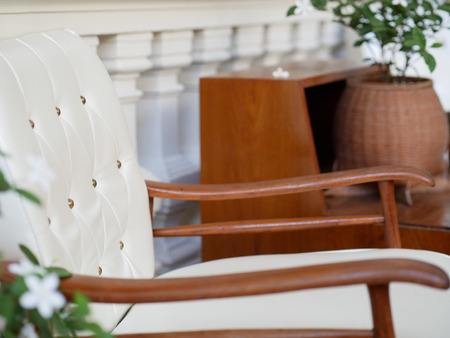 beige leather armchair on terrace at restaurant cafe coffee shopの写真素材
