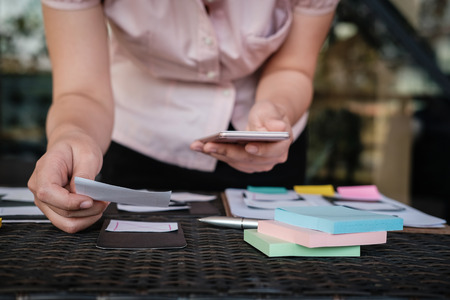 user experience (UX) designer designing web on smart phone layout. UI planning mobile application. developer work with business prototypeの写真素材