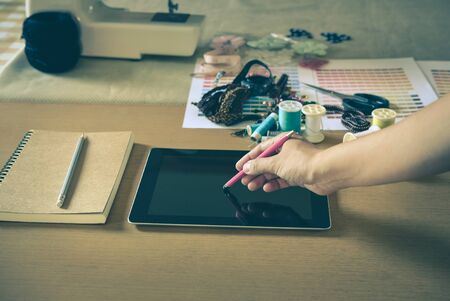 equipment on fashion designer working in studio with equipment on desk. design things in atelierの写真素材