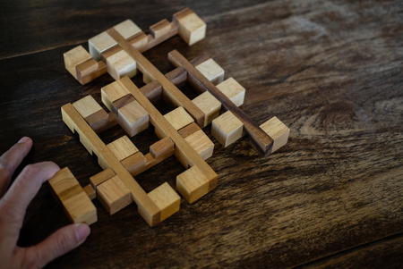 wood block puzzle game. education and leisure concept. growth, success and development in businessの写真素材