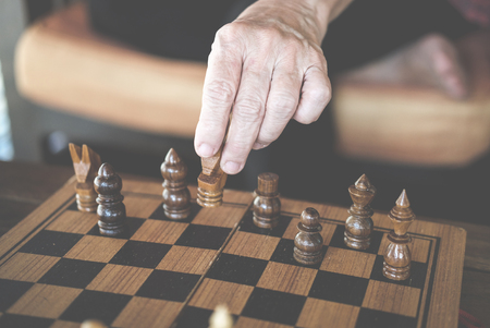 hand playing chess game. business plan & analysis for success. risk and strategy conceptの写真素材
