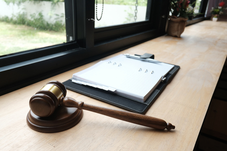 legal law gavel & notebook on wood table. lawyer attorney justice workspaceの写真素材