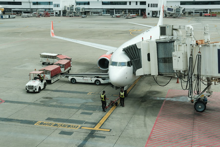 Bangkok, Thailand - July 24, 2018: Thai lion air aircraft park near terminal building gate at Don Mueang international airport at Bangkok, Thailand on July 24, 2018.のeditorial素材