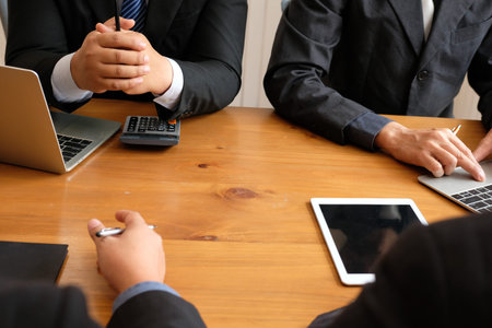 accountant discussing with businessman. internal auditor audit performance revenue. team meeting at...