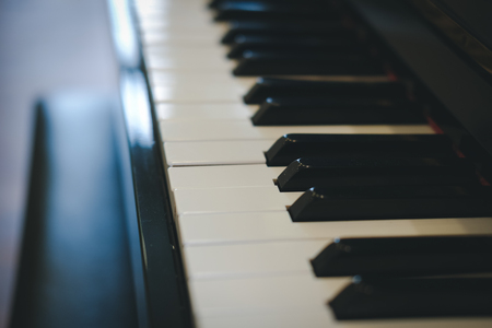 piano keyboard with glossy black & white keys. classic music instrumentの写真素材