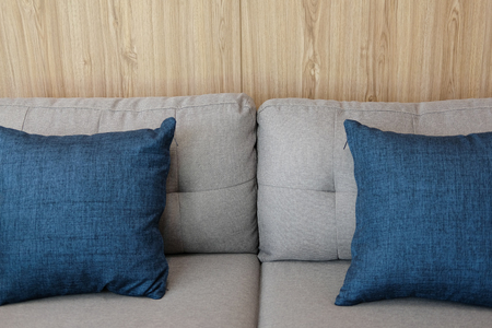 blue fabric pillows on sofa couch furniture in living roomの写真素材