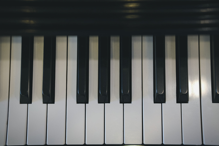 piano keyboard with glossy black & white keys. classic music instrumentの写真素材