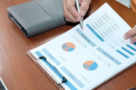 business adviser analyzing company financial report. professional investor reviewing sales data....