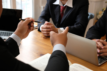 business adviser discussing idea. professional investor have a meeting. businessman working on new startup project with co-worker team.の写真素材