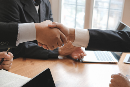 Business people shaking hands after meeting. colleagues handshaking after conference. Greeting deal, teamwork, partnership, cooperate concept.の写真素材