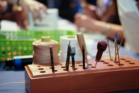 handmade leather craft DIY instrument tool. craftsman working deskの写真素材