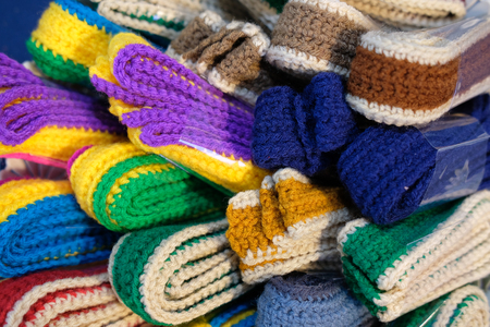 colorful knitted belt. knitting fabric strap. handmade handicraft embroidery accessoryの写真素材