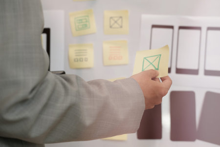 user experience, UX designer designing web on smart phone layout. UI planning mobile application....