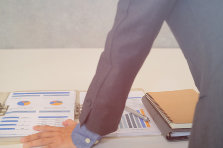 startup businessman working with document at office. young man entrepreneur analyze financial data at workplace.の写真素材