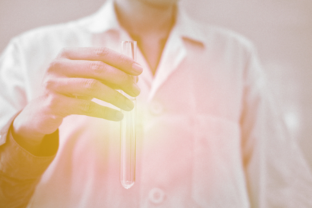 scientist working with test tube. researcher doing research investigation. chemistry biology science conceptの写真素材