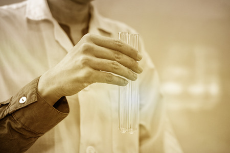 scientist working with test tube. researcher doing research investigation. chemistry biology science conceptの写真素材