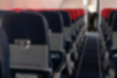 empty passenger seat inside airplane. row of chair in aircraft. blurry backgroundの写真素材