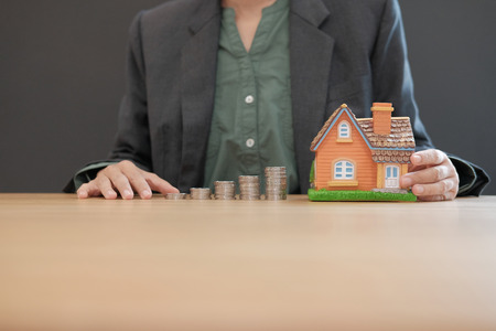house model & coins stack. saving money for buying house property. real estate investment finance & bankingの写真素材