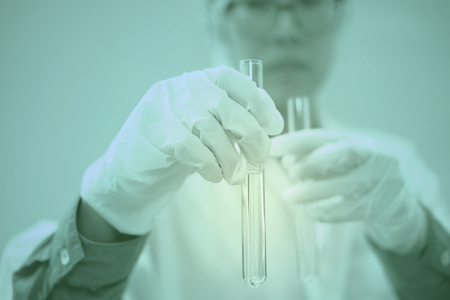 scientist working with test tube. researcher doing research investigation. chemistry biology science conceptの写真素材