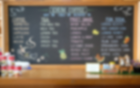 handdrawing beverage refreshment drink menu on blackboard chalkboard. blurry backgroundの写真素材