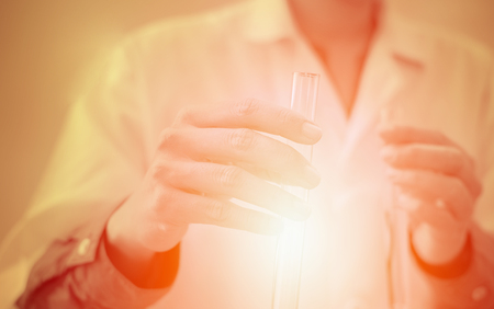 scientist working with test tube. researcher doing research investigation. chemistry biology science conceptの写真素材