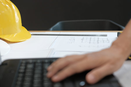 architect engineer working on house blueprint of real estate project at workplace. construction &...