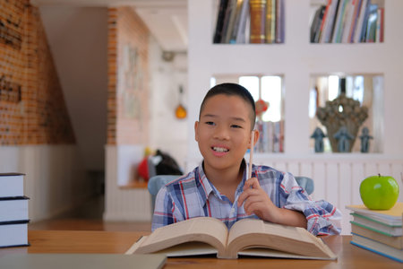 young little asian kid boy child children schoolboy thinking. childhood education