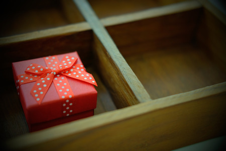 gift in wooden box. christmas present. anniversary birthday holiday celebrationの写真素材