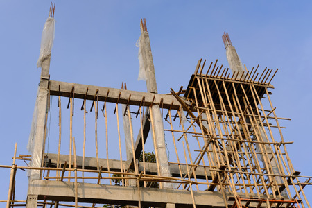 building pole pillar with steel & cement concrete under constructionの写真素材