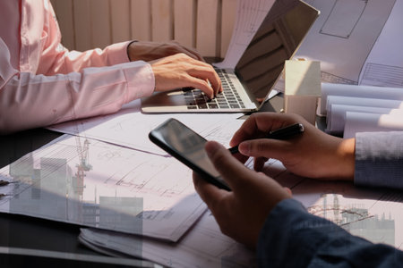 architect engineer team working on house blueprint of real estate project at workplace. building...