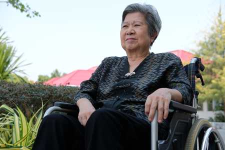 old elder woman sitting at home. elderly female relaxing outdoors. senior leisure lifestyleの写真素材