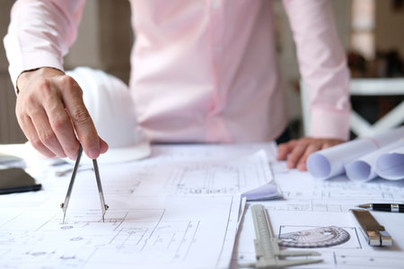 architect engineer working on house blueprint of real estate project at workplace. construction &...
