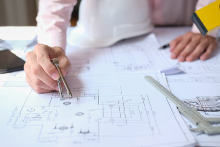 architect engineer working on house blueprint of real estate project at workplace. construction &...