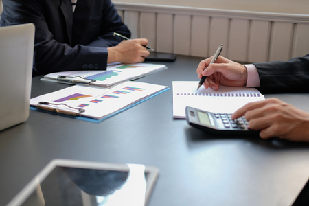 business people working with calculator document. financial advisor accountant teamworkの写真素材
