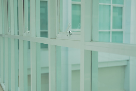 row of white awning aluminium push office windowの写真素材
