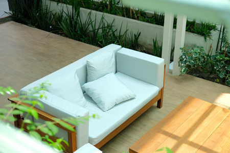 white sofa couch on terrace patio in gardenの写真素材