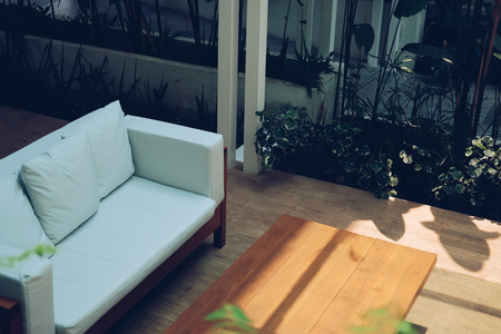 white sofa couch on terrace patio in gardenの写真素材