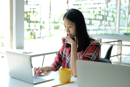girl teenager college high school student studying with computer laptopの写真素材