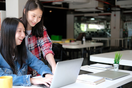 girl teenager college high school student studying with computer laptopの写真素材