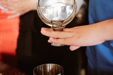 bartender preparing mocktail beverage at bar restaurant