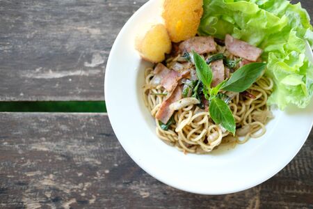 spaghetti with ham, dried red chilli & vegetable pepperの写真素材